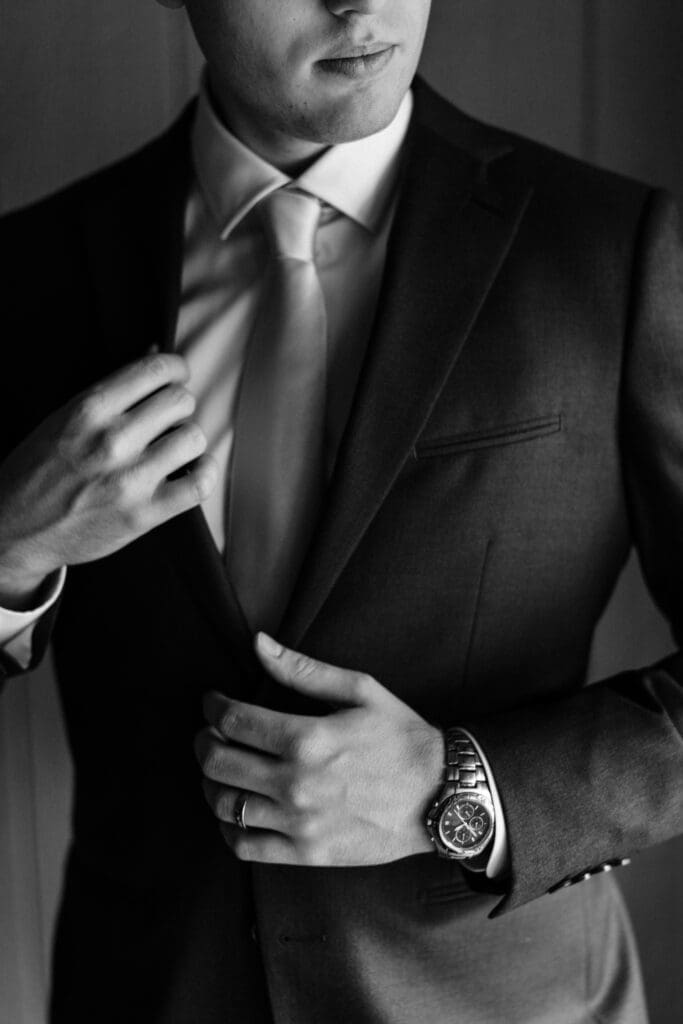 Groom getting ready in Hive & Colony Suit at Jack's Barn wedding venue.