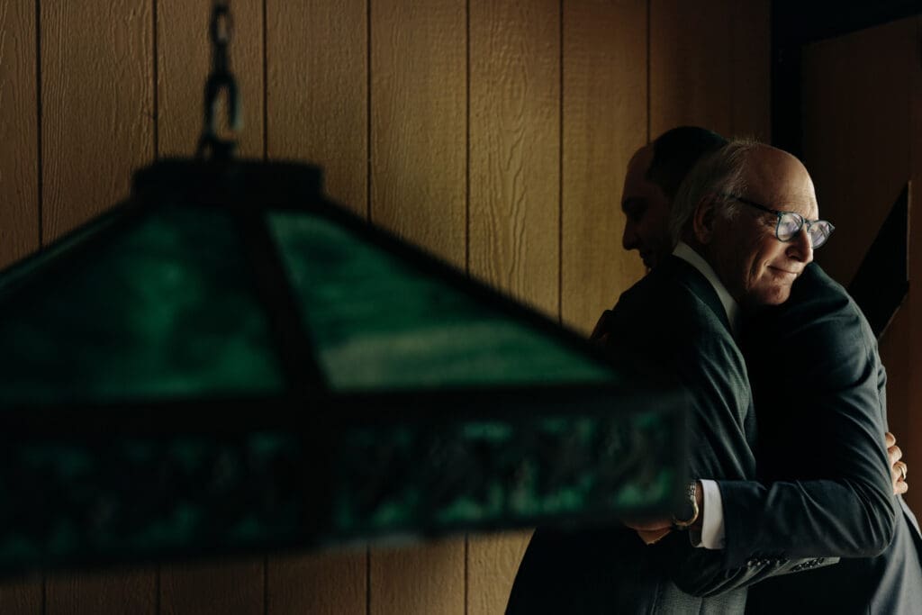 Father of Groom hugging his son in Oxford, NJ.