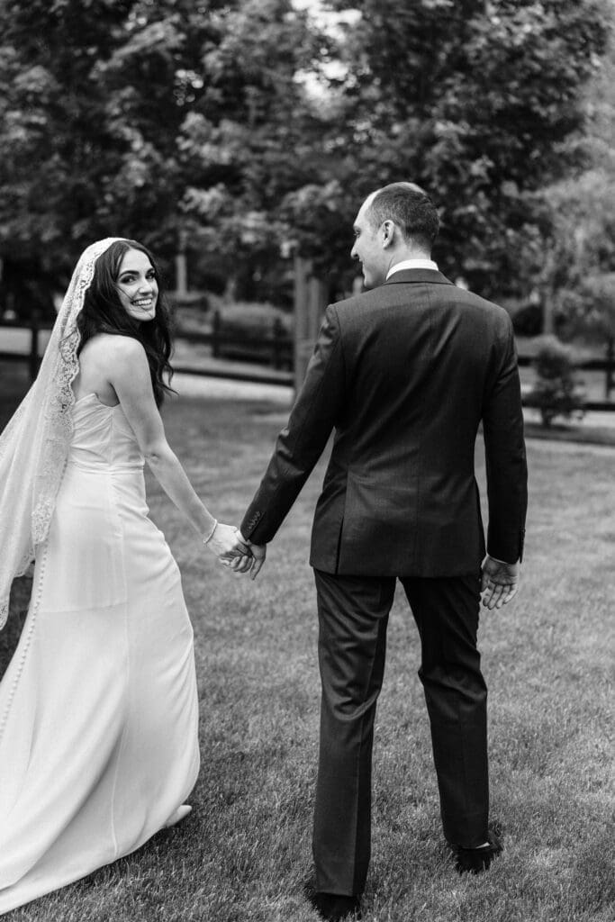 Bride and Groom walking together at Jack's Barn.