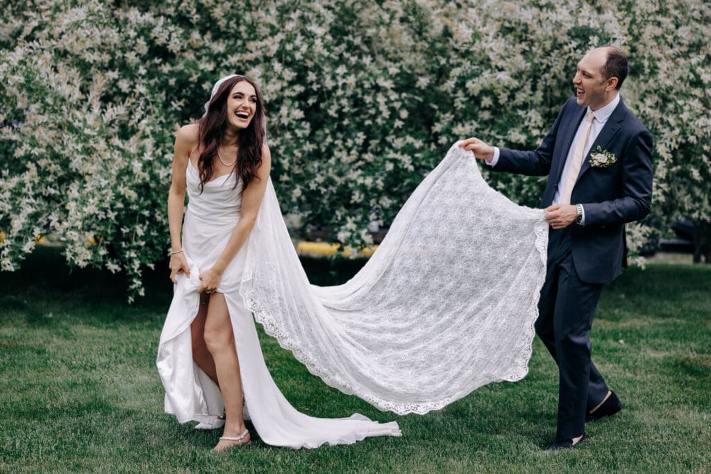 Bride and Groom laughing and being playful. 