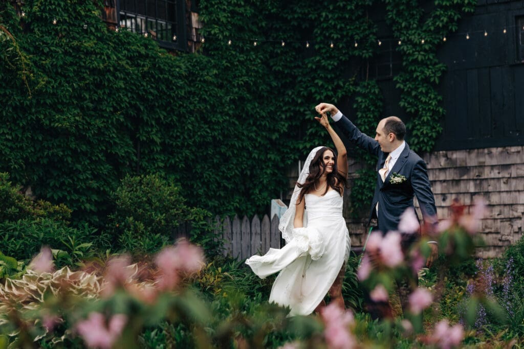 Groom spinning his wife and laughing together in New Jersey.