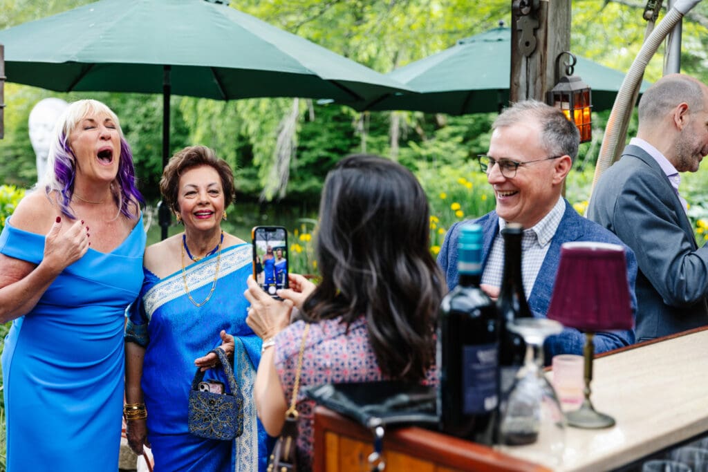 Family and friends socializing during cocktail hour at Rat's Restaurant in Hamilton Township, New Jersey.